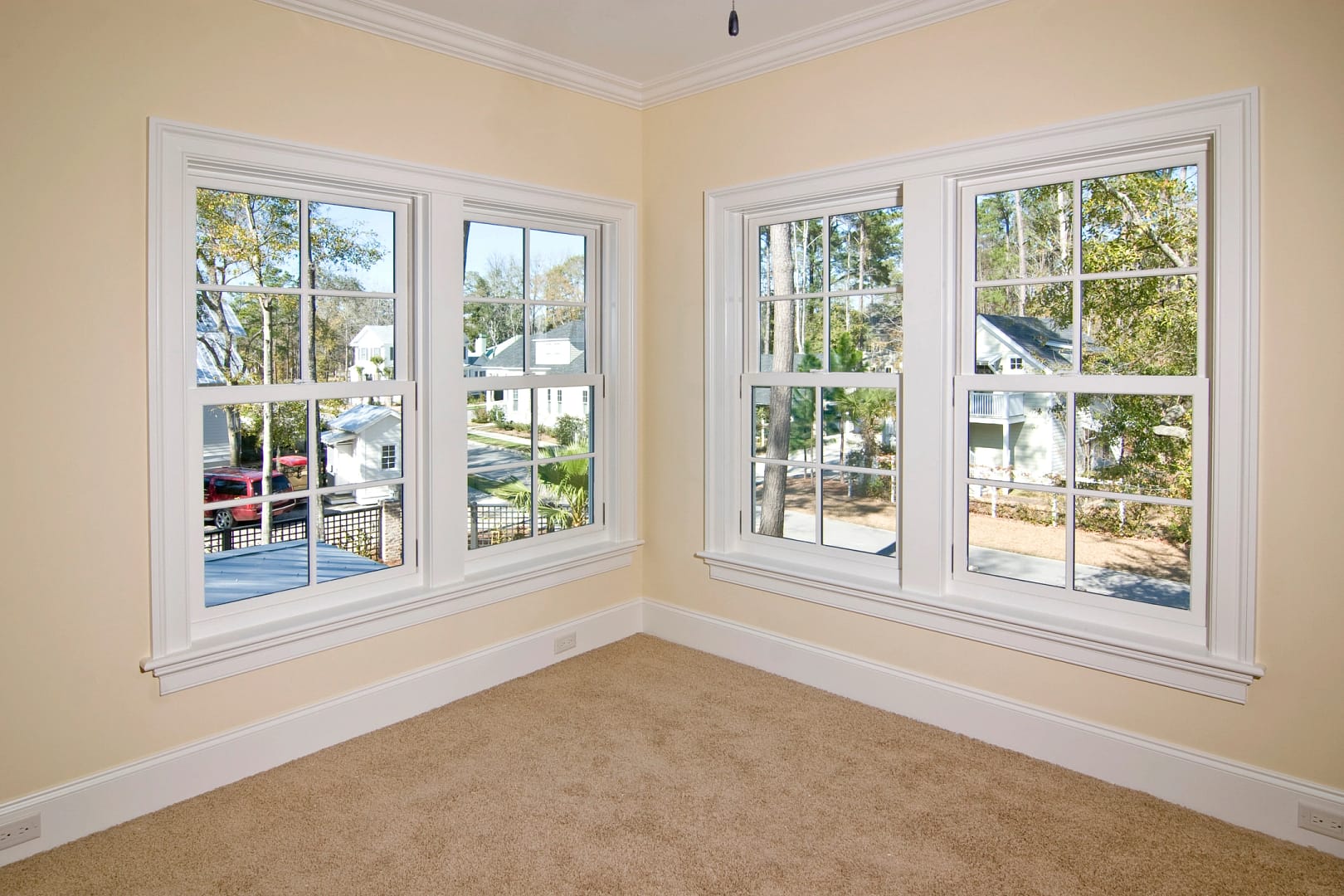 columbus window replacement with white frames on yellow walls