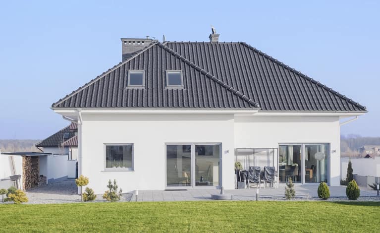 new house with metal roof and windows