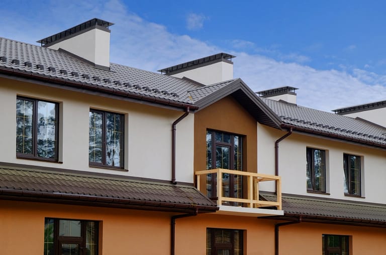 cottage house with new metal roofing