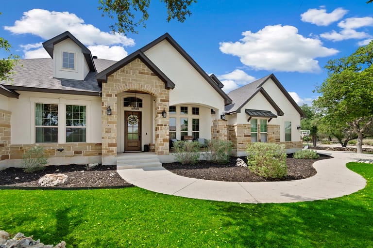 modern house exterior with green lawn