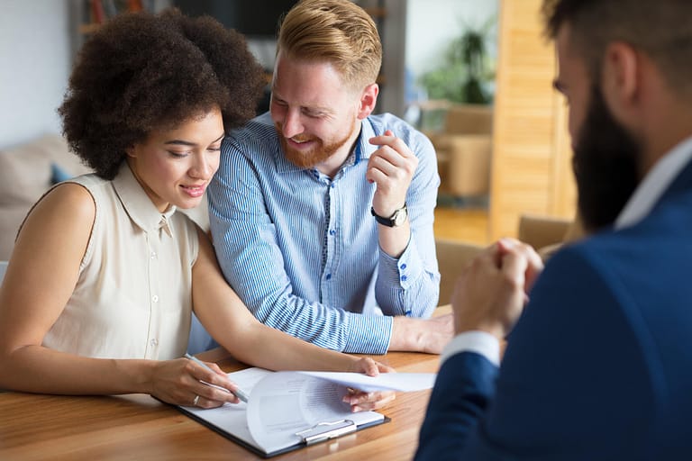 roof warranty-a couple going over their roof warranty contract