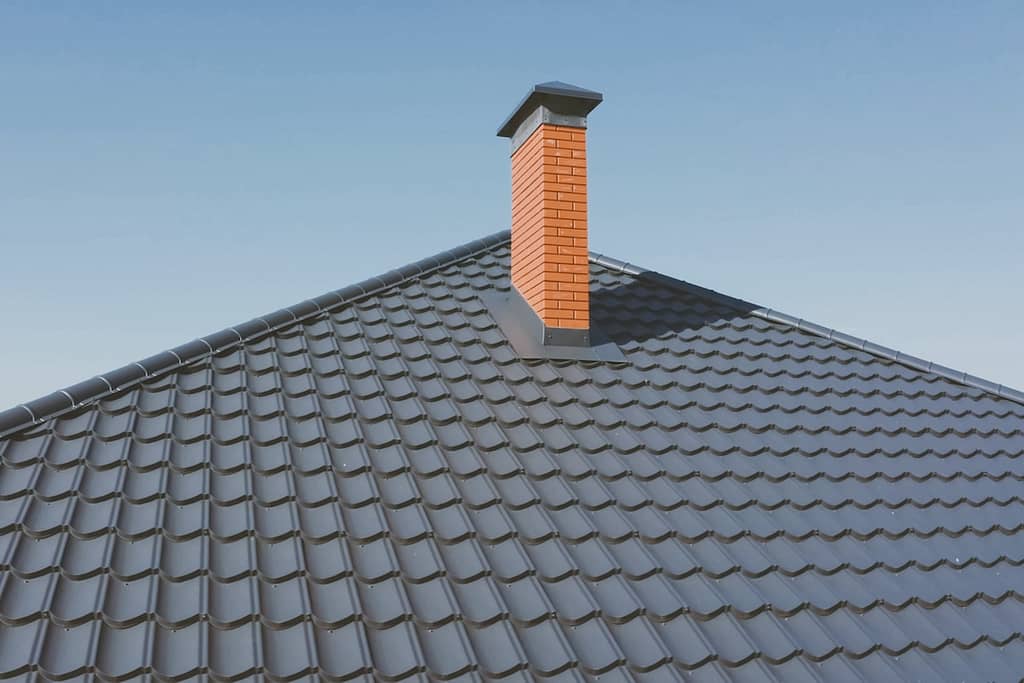 Modern roof made of metal. Corrugated metal roof and metal roofing.