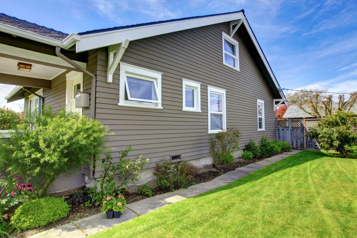 new types of siding in brown beige color on residential home