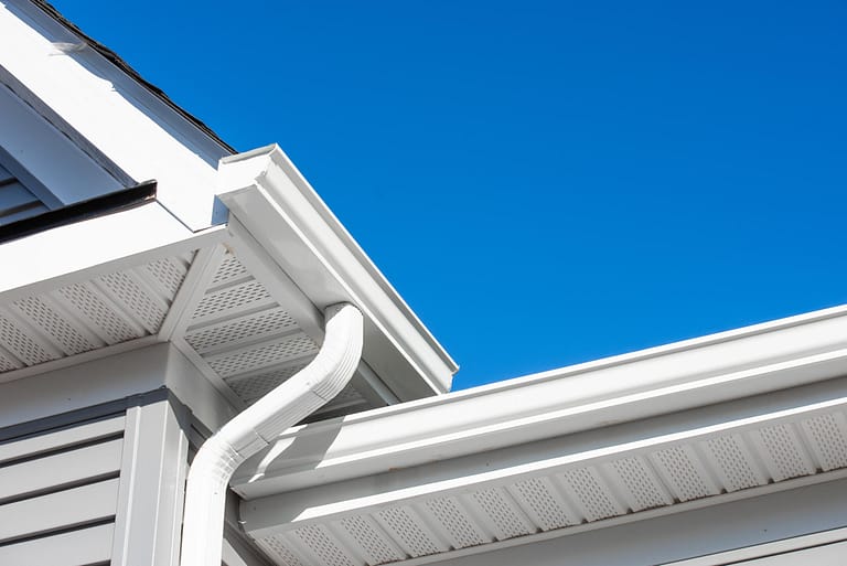 gutter colors-white gutters on blue sided house
