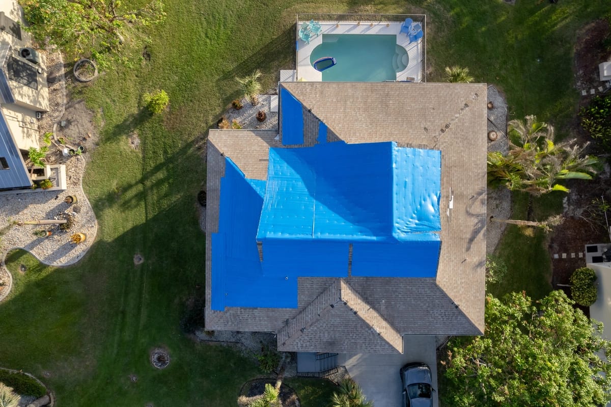 Florida house roof covered to be fixed after hurricane