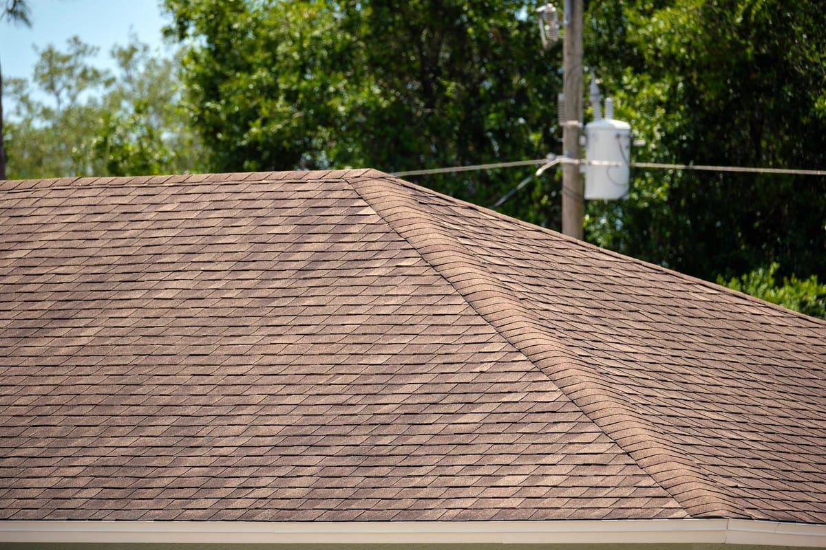 house roof with brown asphalt shingles