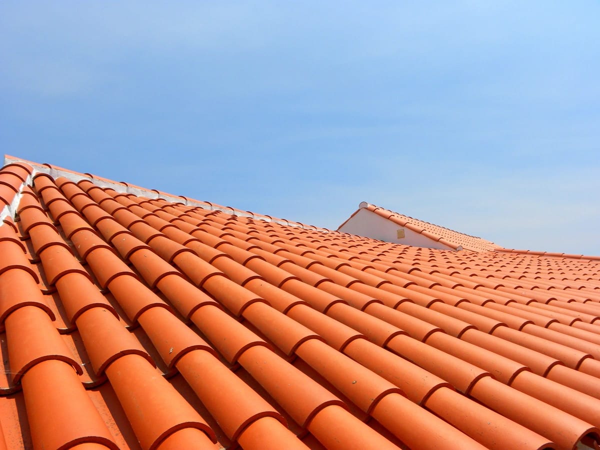 clay tile roof against sky
