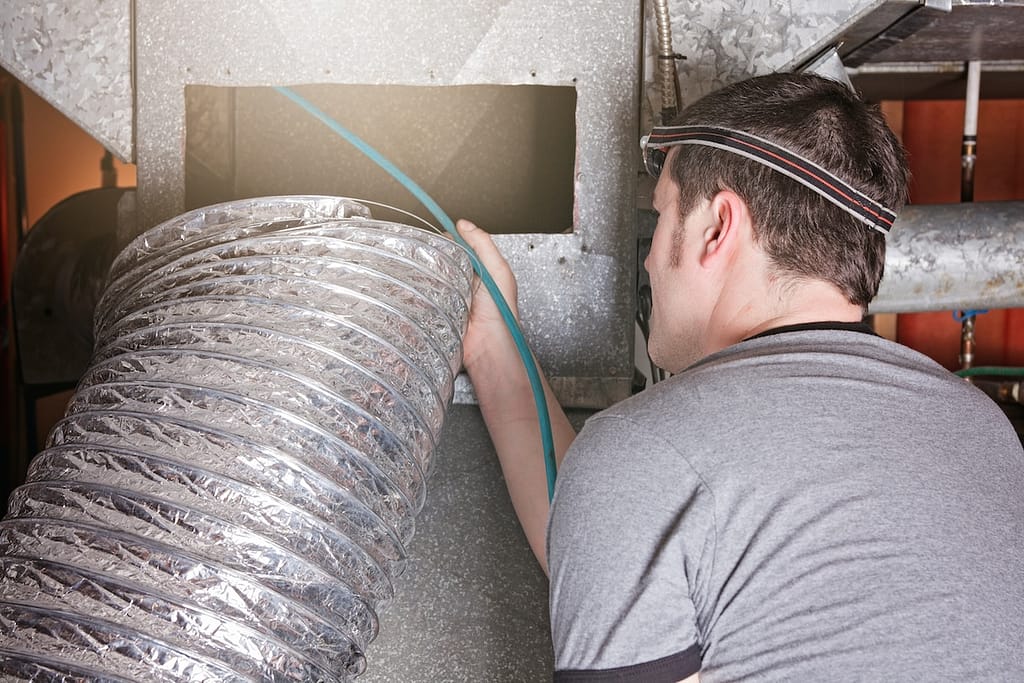 how to clean air ducts ventilation cleaner man at work with tool