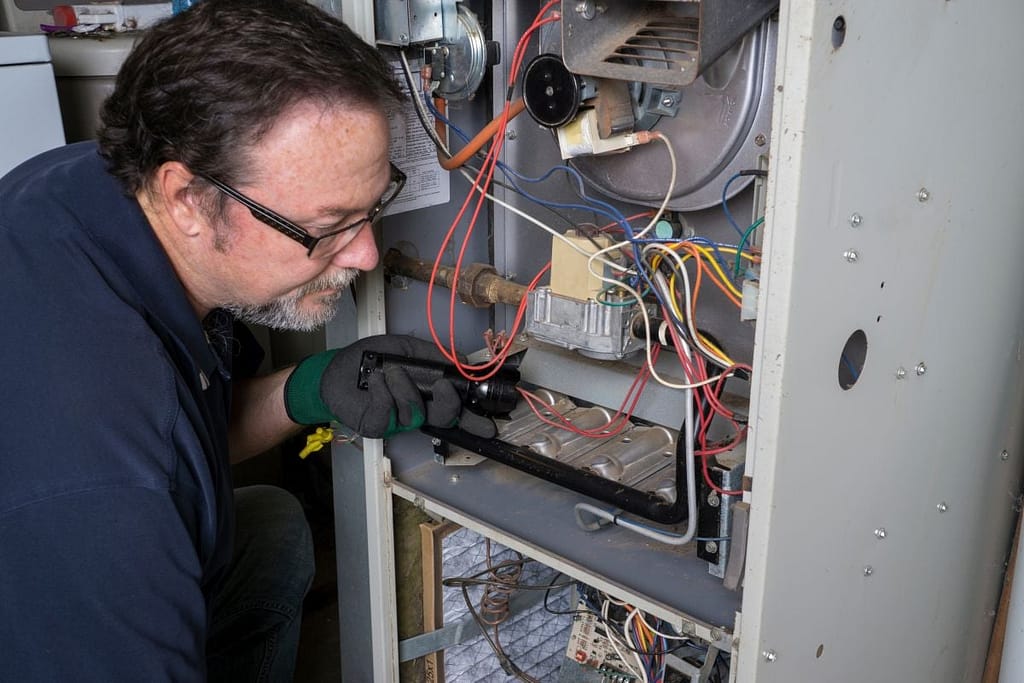 how long does a furnace old technician repairing open furnace