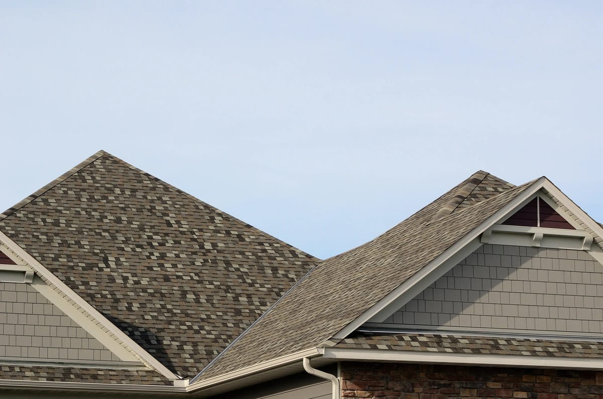 brown shingle roof against sky