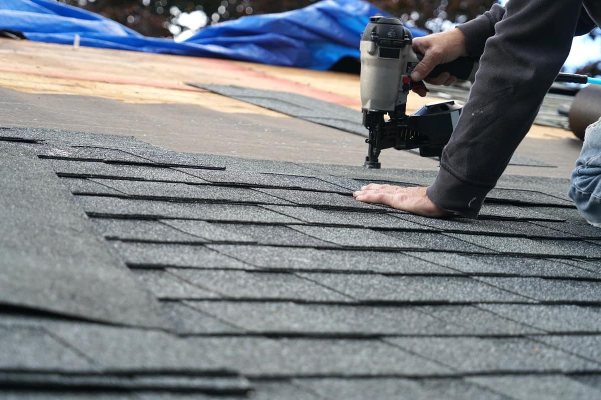 closeup of roof repairs after completing storm damage insurance claim