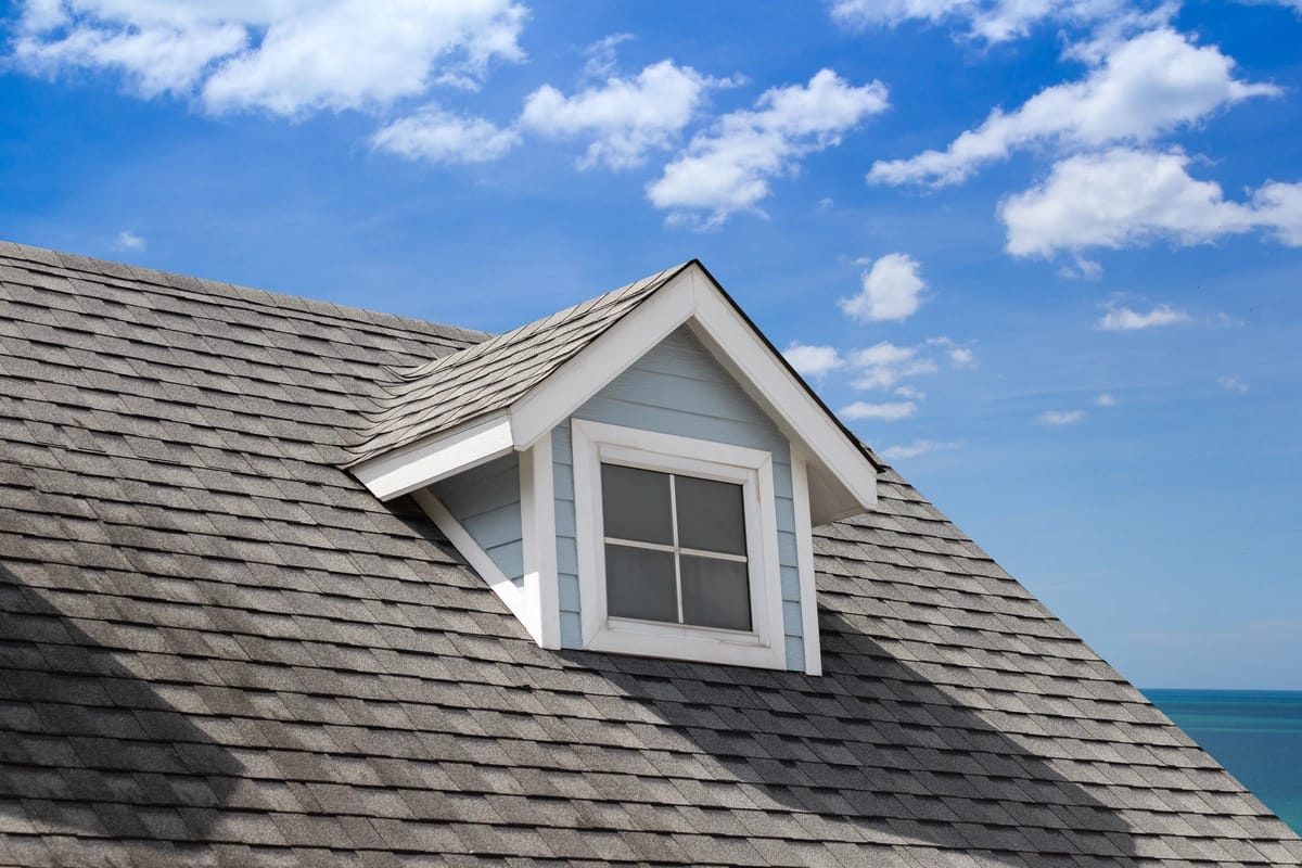 close up to asphalt shingle roof and dormer