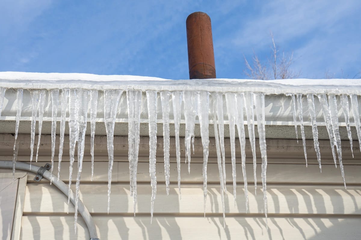 close up to house roof with ice dams