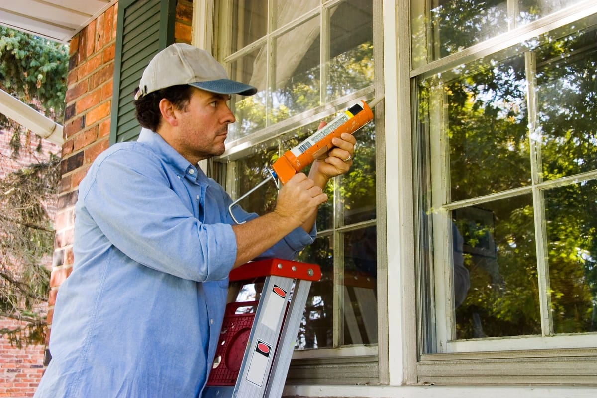 Man with a caulk gun