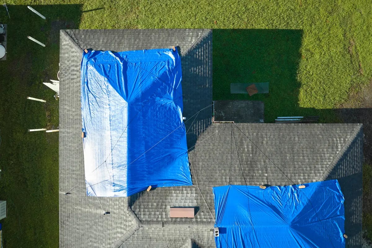 two tarps on a roof