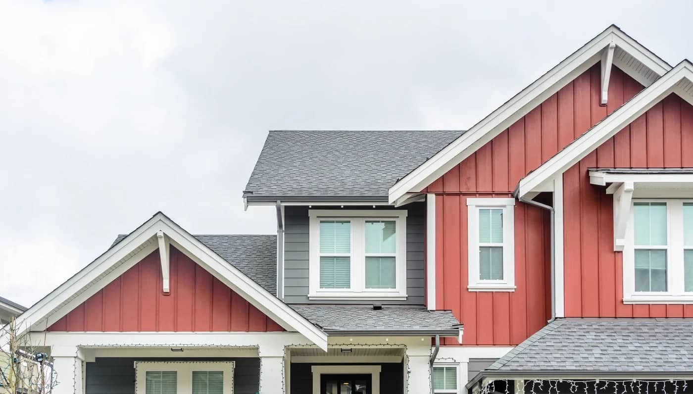 residential home with red siding and shingle roof lebanon oh