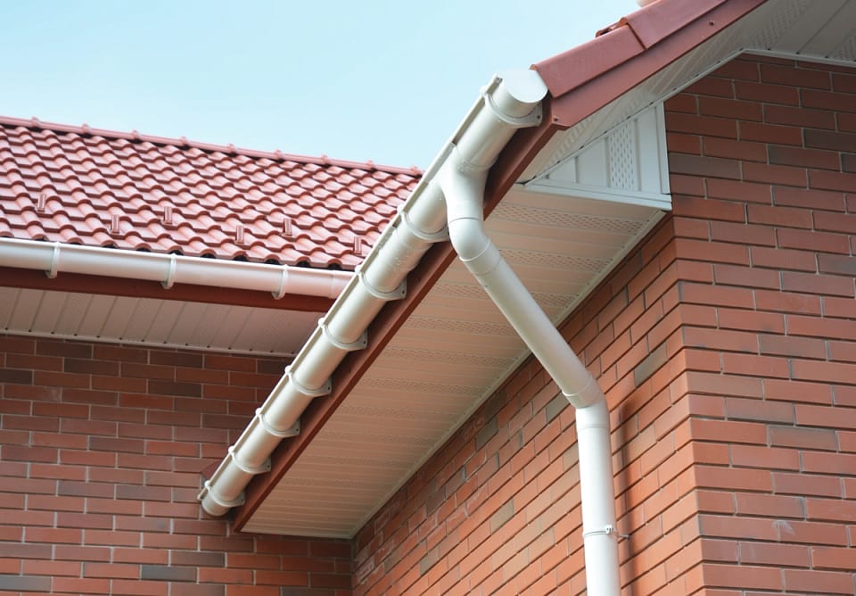 gutter system on tile roof of house