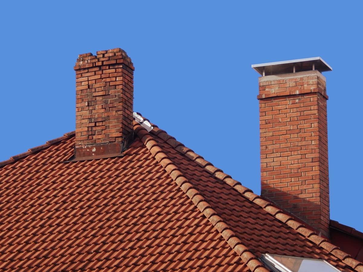 brick chimney damaged flashing on roof