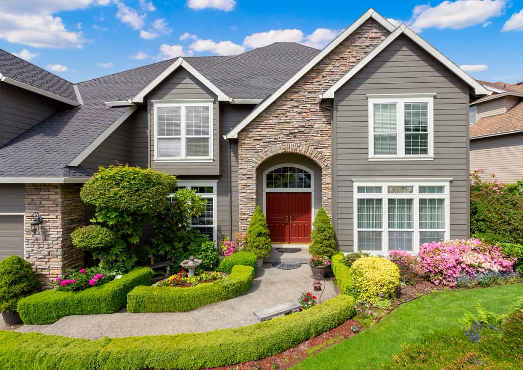 a home with gray siding