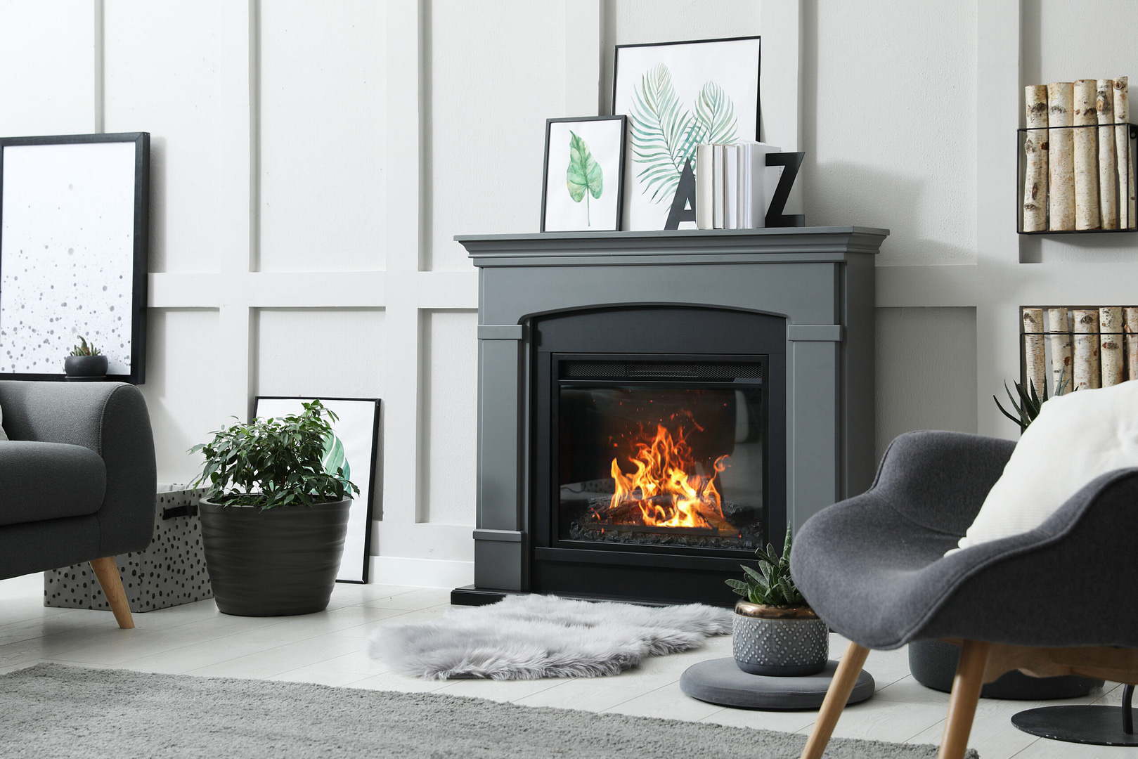 Transform your living room into a cozy retreat with our expert design tips. Picture a lit fireplace set against elegant paneled white walls, accented by framed botanical prints on the mantel. Add comfort with a stylish gray armchair and a lush potted plant. Complete the inviting atmosphere with a plush rug to enhance warmth and coziness in your space.