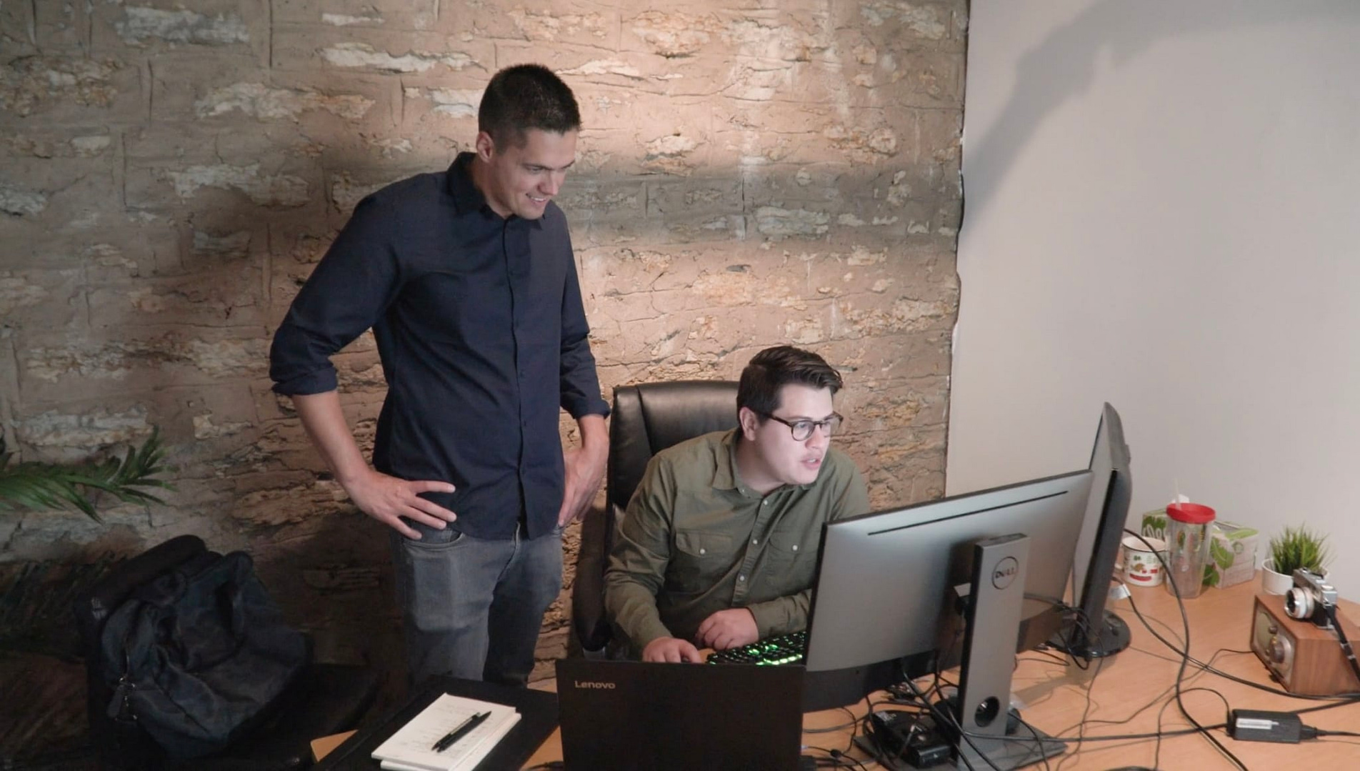 Two Web Designers working on user experience or user interface in office