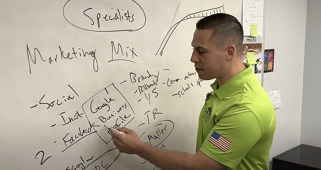How to Market a Roofing Company, Ethan Andes or Andes Roofing at a White Board sharing his marketing secrets