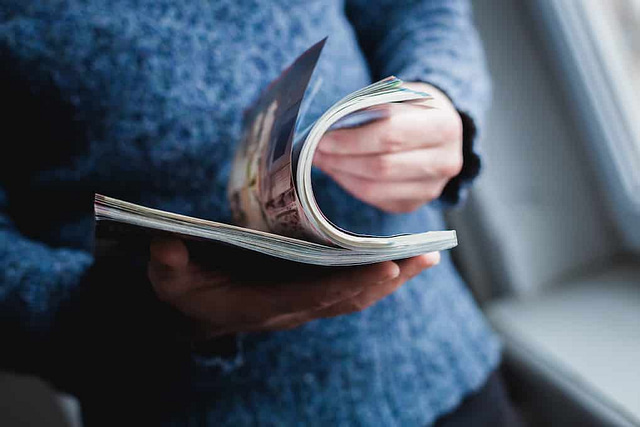 A man looks at a construction industry magazine