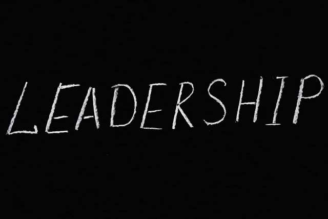 LEADERSHIP" is boldly displayed in white chalk on a blackboard, representing essential strategies to elevate your roofing business.