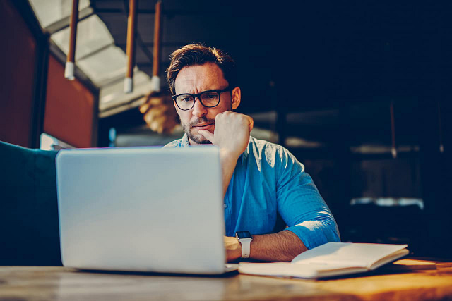 business owner completing web maintenance tasks on his website