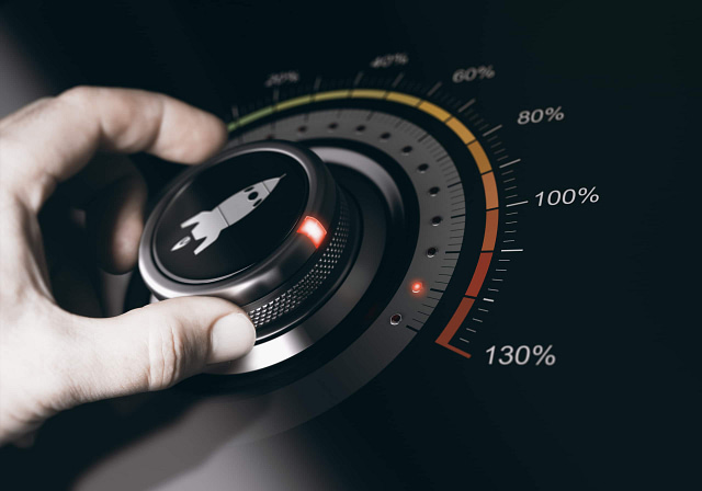 On Hook Agency's website, an illustration depicts a hand turning a rocket icon dial on a gauge. The gauge measures growth speed, ranging from 0% to 130%, with the needle approaching 100%. Green, yellow, and red sections signal different intensity levels and potential risks.