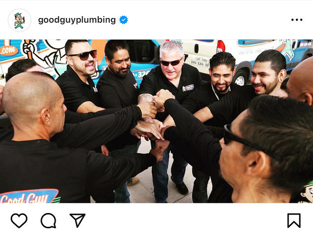 A team of men in matching Good Guy Plumbing shirts stand outdoors, smiling and joining fists in a show of unity, while a branded van is visible behind them. Capture this moment to highlight your company culture and team spirit—perfect content for engaging social media posts.
