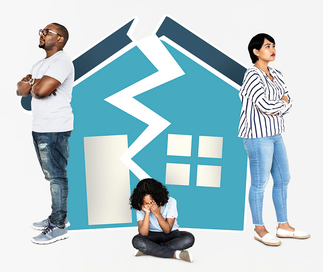 A man and a woman stand back-to-back in disagreement, with their child sitting on the floor, face buried in their hands. A split house illustration looms behind them, symbolizing a fractured home. It seems like a task for expert roofers to bridge this divide.