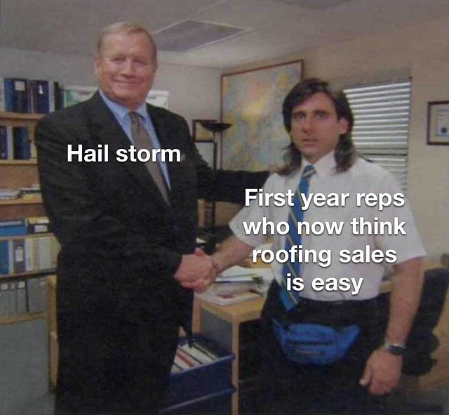 A man in a suit labeled "Hail storm" shakes hands with another man sporting long hair and a blue fanny pack labeled "First year reps who now think roofing sales is easy" in an office. Shelves and a painting adorn the background, setting the stage for their discussion on roofing leads.
