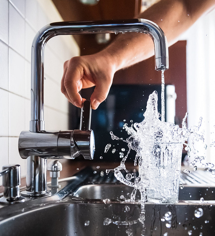 Water glass with water. Plumbing industry statistics.