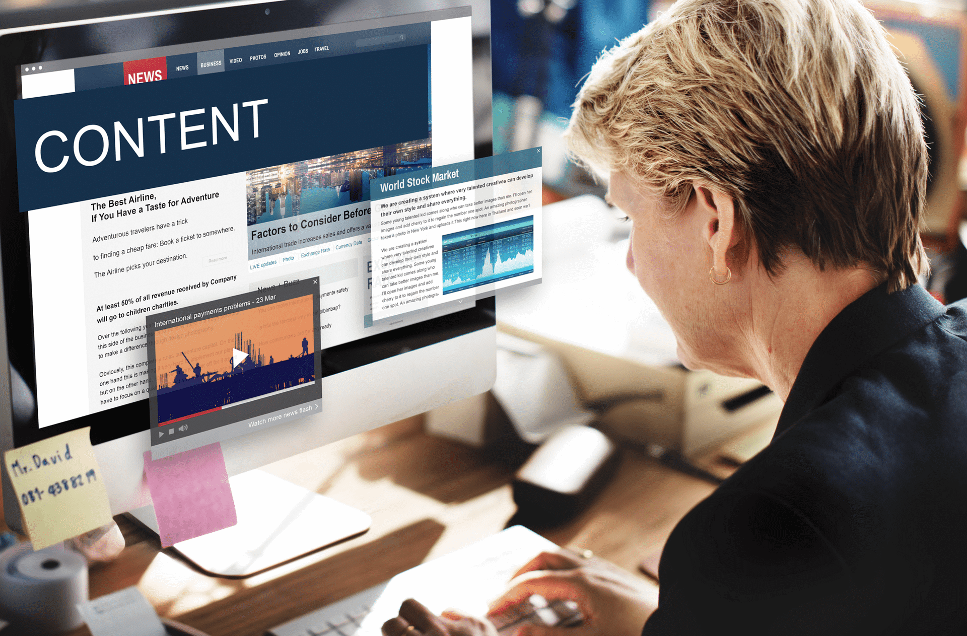 A woman working on the computer.