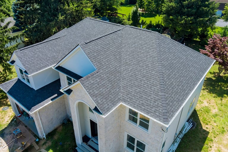 large home shingle roof new