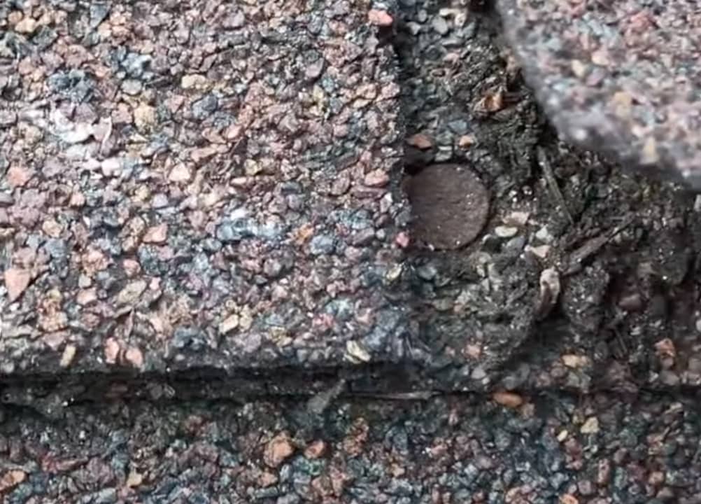 rusted nail moisture underneath shingle