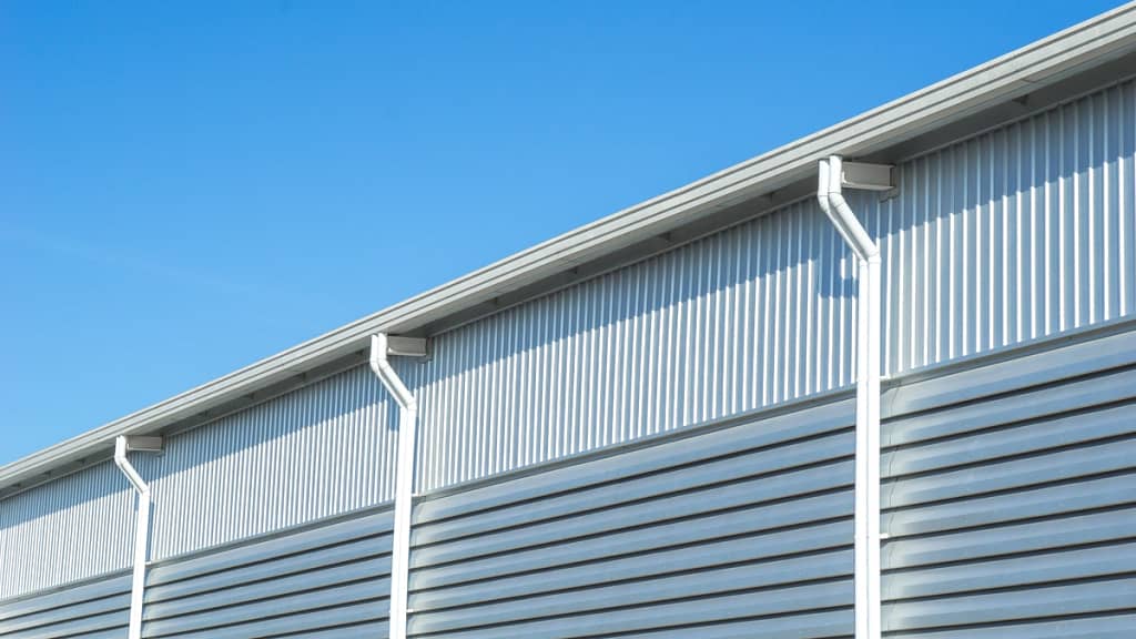 commercial rooftop with white gutters