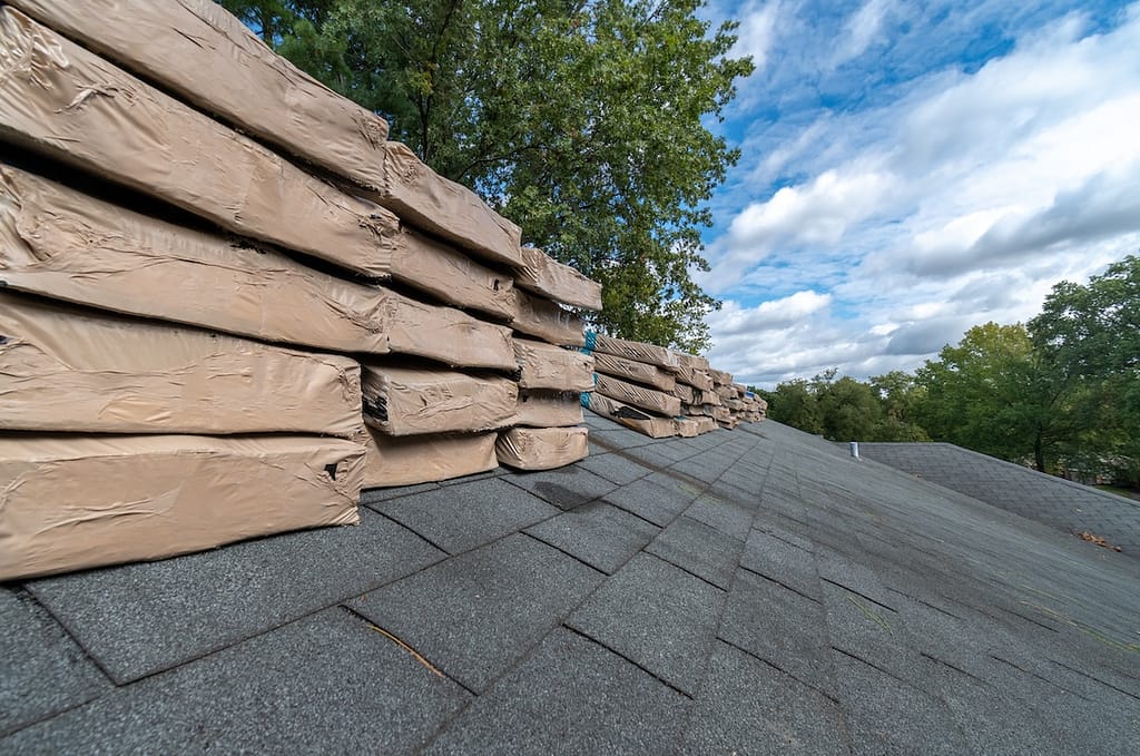 Bundles of shingles stacked on roof