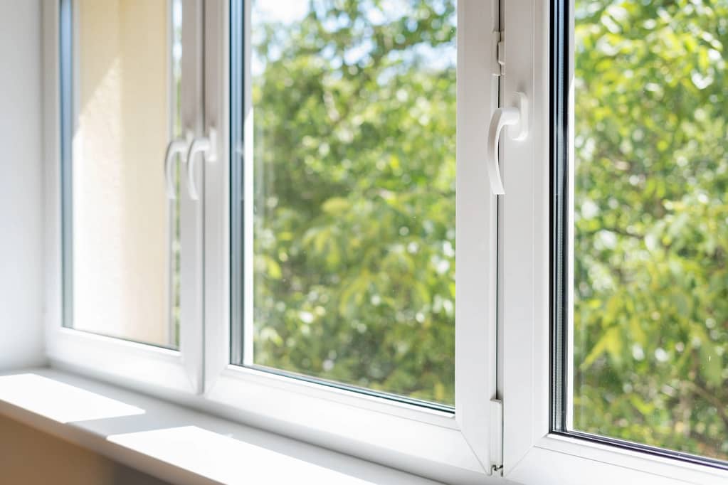 close up view of white frame windows installed in residential home