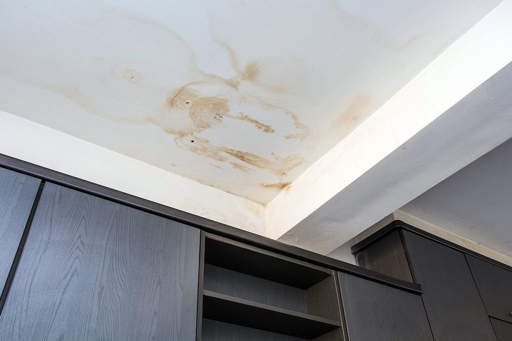 Roof leakage, water damaged ceiling roof and stain on ceiling
