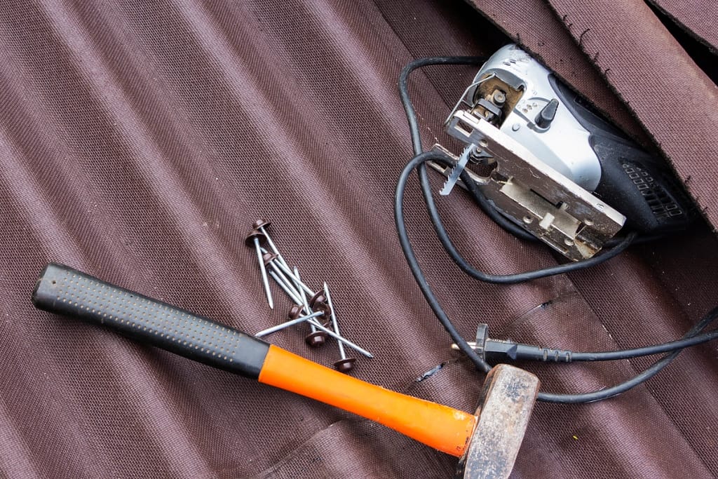 roofing tools- hammer on roofing sheet