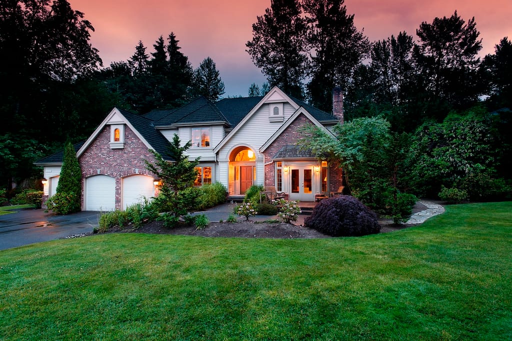 what is a hopper window Lights shine from a suburban home at dusk