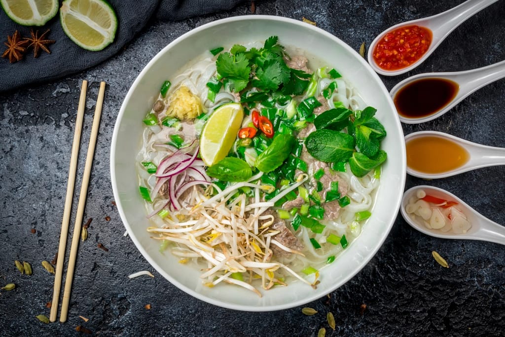 warm bowl of pho with meat and noodles 