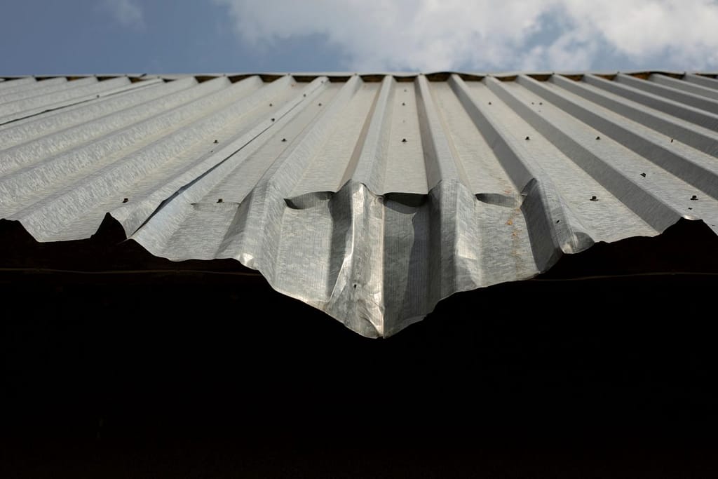 damaged metal roof after hail storm