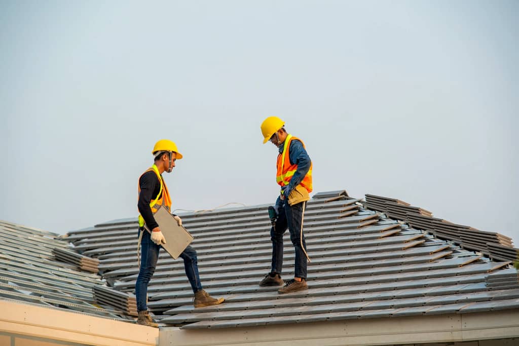 workers building commercial building roof