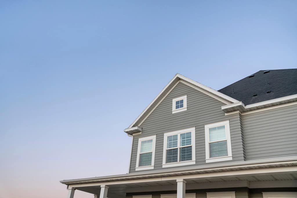 gray vinyl siding house view against sky