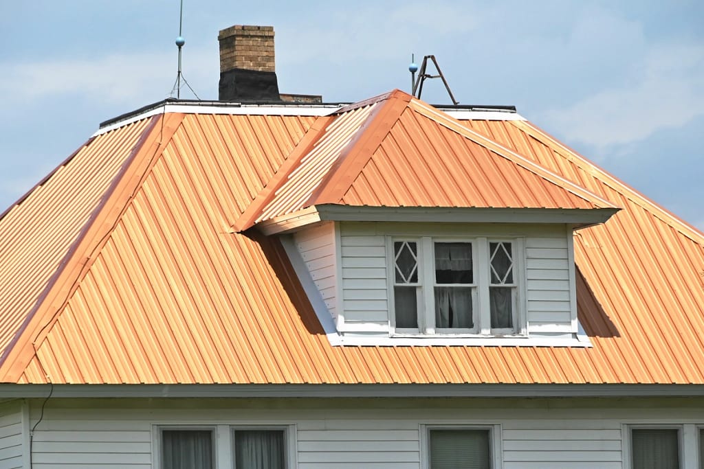 white house with a copper roof