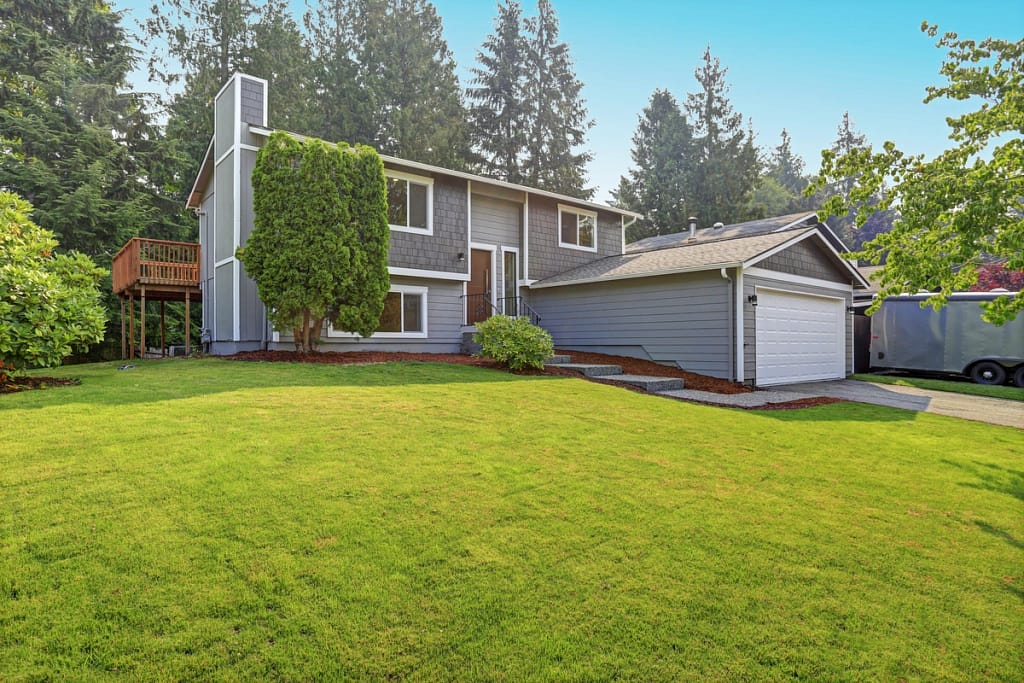 charcoal grey siding on a home with white trim
