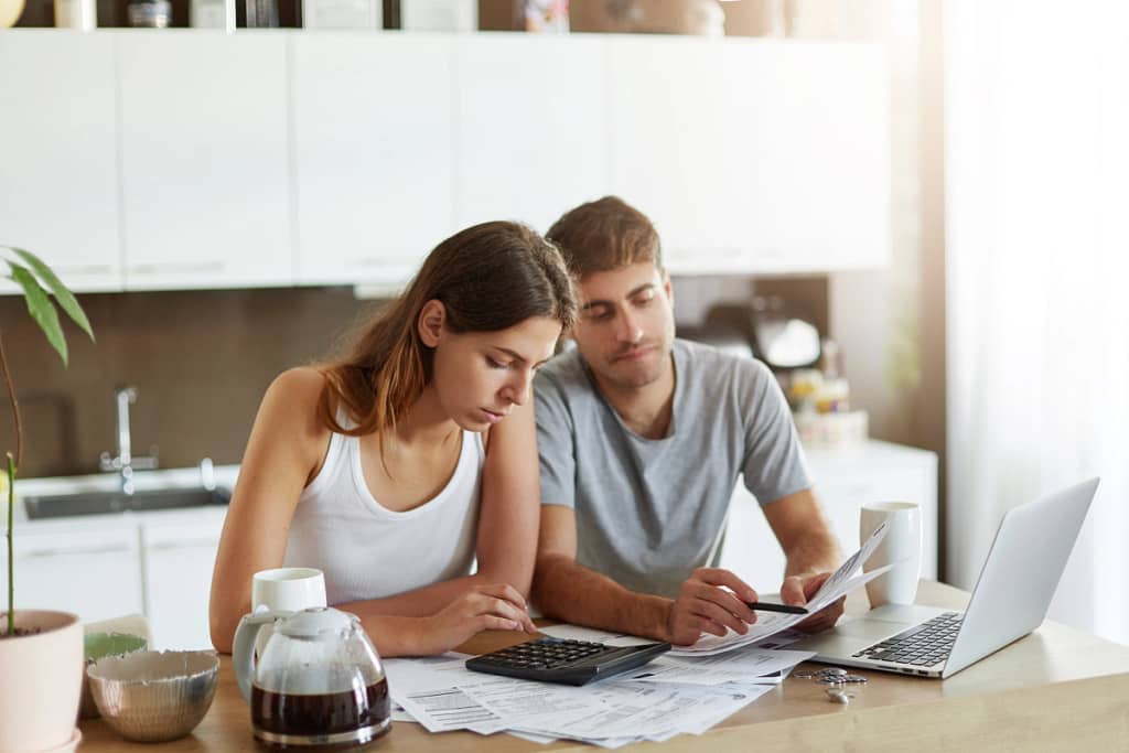 A couple is looking at paperwork
